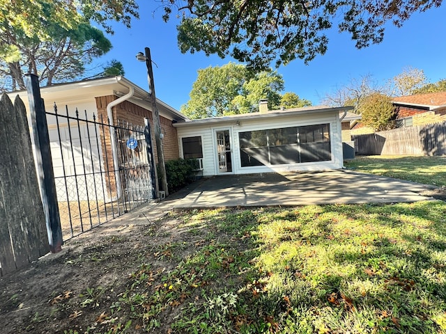 back of house with a yard