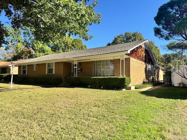 ranch-style home with a front yard