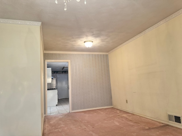 empty room with light carpet and ornamental molding