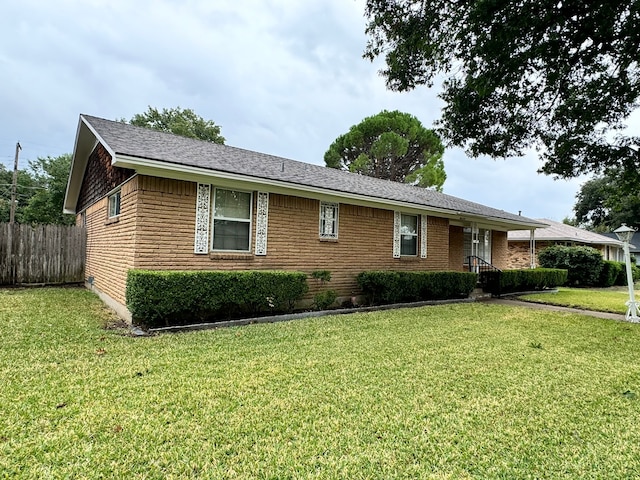 ranch-style house featuring a front lawn