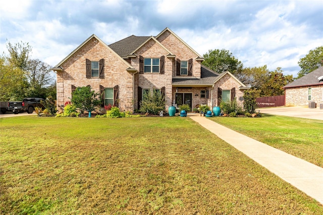 craftsman inspired home with a front lawn and cooling unit