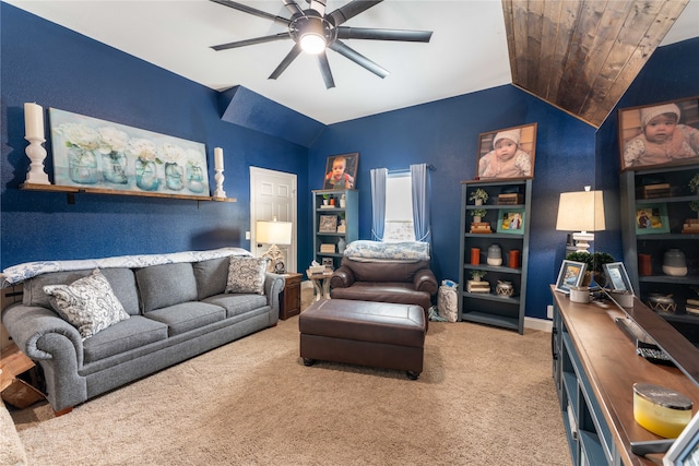 living room with ceiling fan, carpet floors, and vaulted ceiling