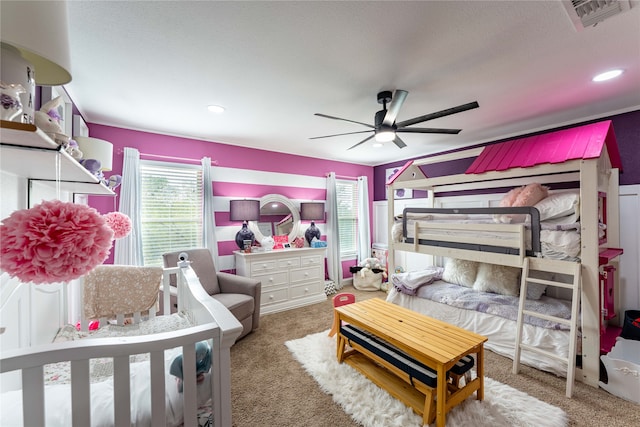 bedroom featuring a textured ceiling, carpet floors, and ceiling fan