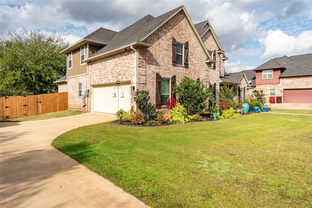 view of front of property with a garage and a front lawn