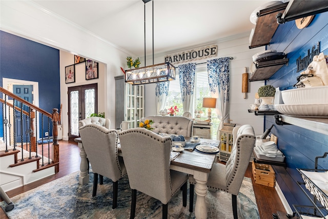 dining room with french doors, dark hardwood / wood-style flooring, and a healthy amount of sunlight