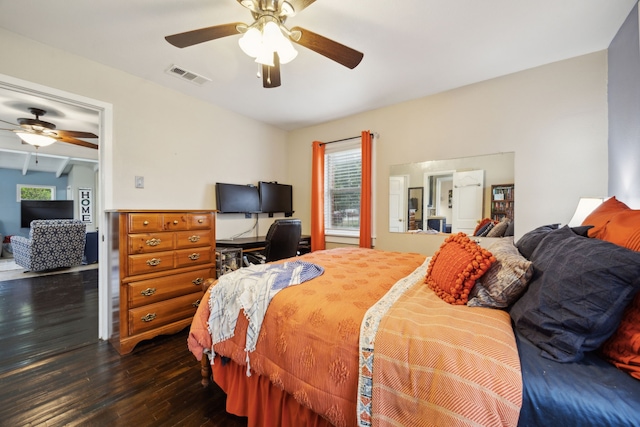 bedroom with lofted ceiling with beams, ceiling fan, and dark hardwood / wood-style floors