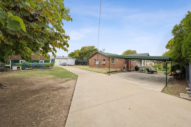 view of front of house featuring a front yard and a carport