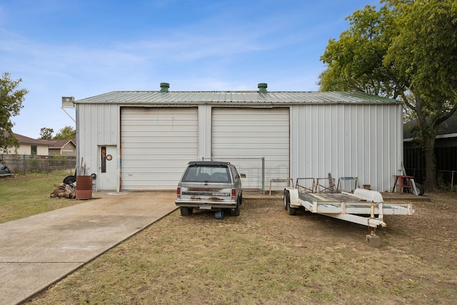 garage featuring a lawn