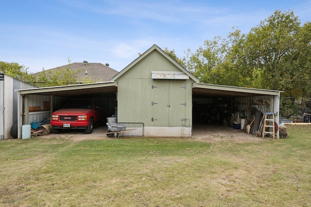 view of outdoor structure featuring a lawn