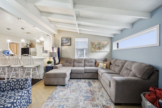 carpeted living room featuring vaulted ceiling with beams