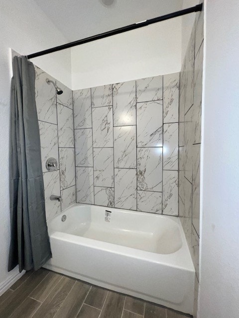 bathroom with shower / bath combination with curtain