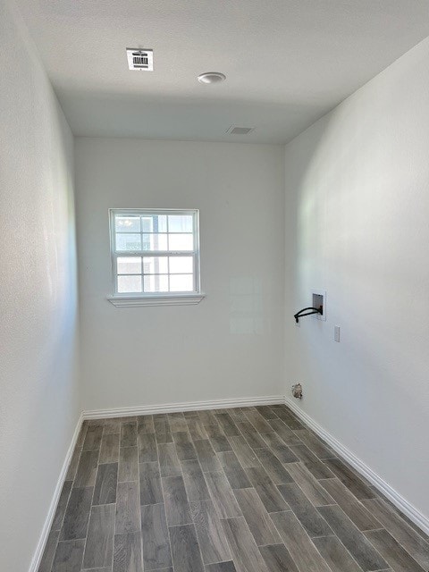 unfurnished room with dark hardwood / wood-style floors