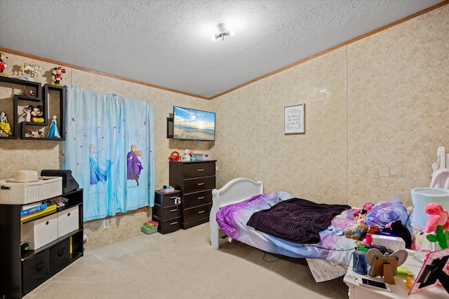 bedroom with crown molding, carpet, and a textured ceiling