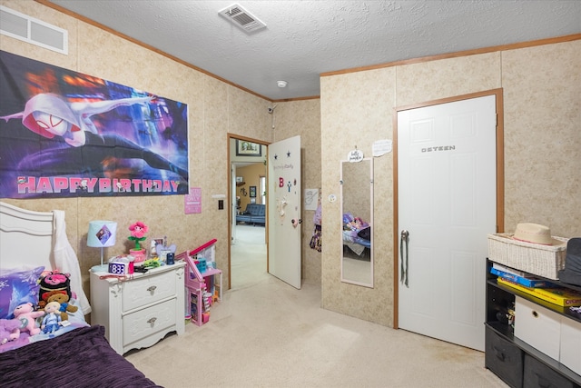 carpeted bedroom featuring crown molding and a textured ceiling