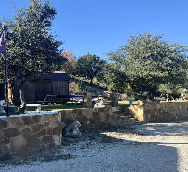 view of yard with a storage shed