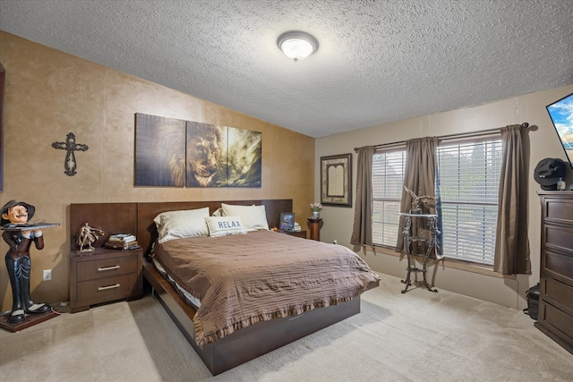 carpeted bedroom with lofted ceiling and a textured ceiling