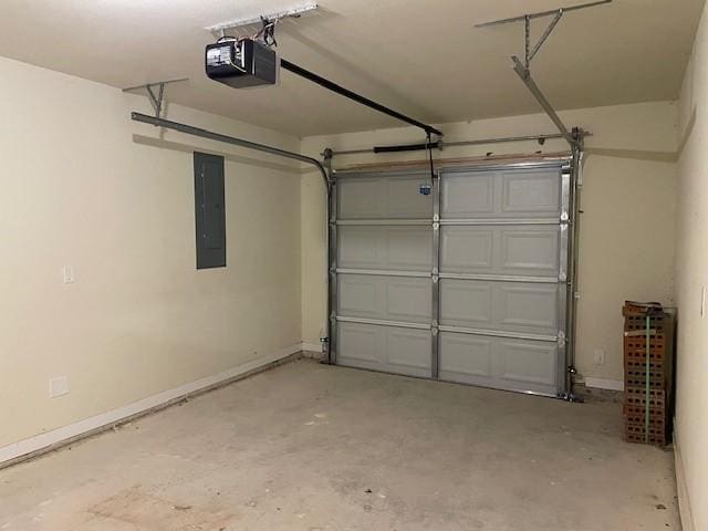 garage featuring electric panel and a garage door opener