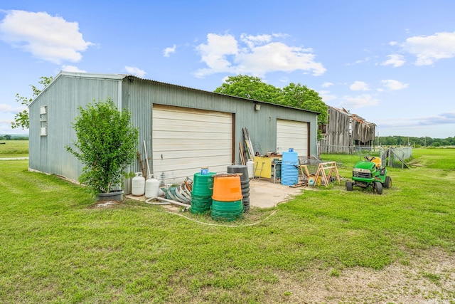 garage featuring a yard