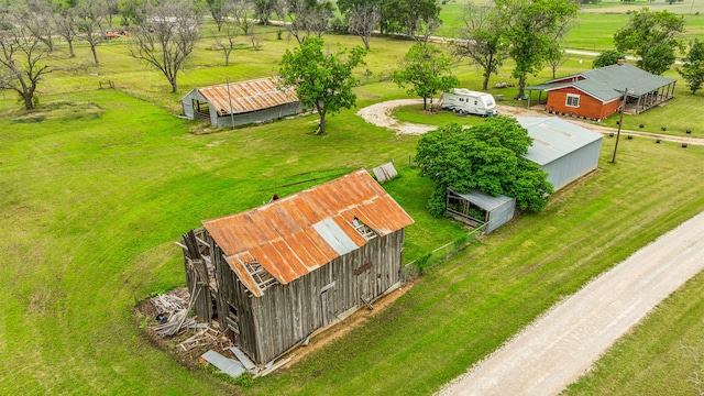 birds eye view of property featuring a rural view