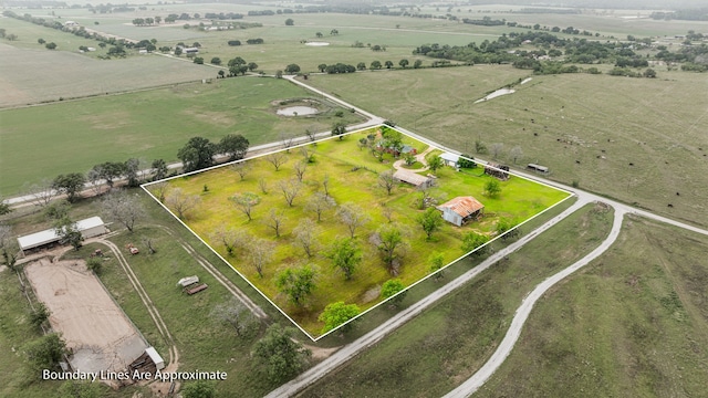 birds eye view of property featuring a rural view