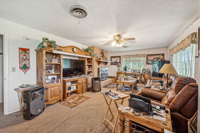 living room featuring a wealth of natural light, a textured ceiling, and ceiling fan