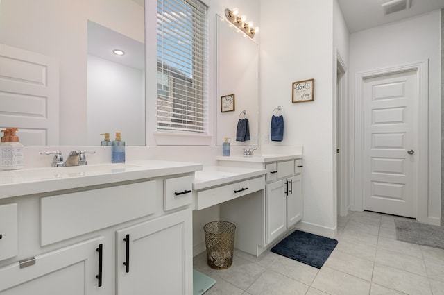 bathroom featuring tile patterned flooring and vanity