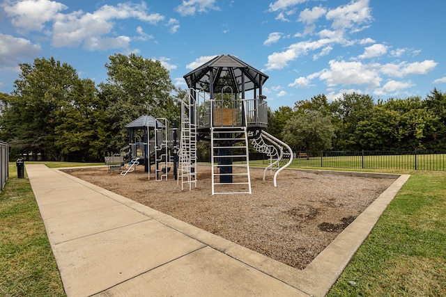 view of jungle gym with a lawn