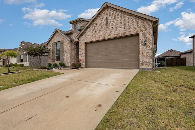 view of front of home featuring a front yard and a garage