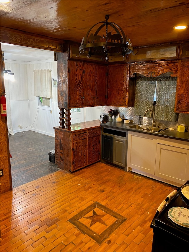 kitchen featuring cooling unit, sink, and backsplash