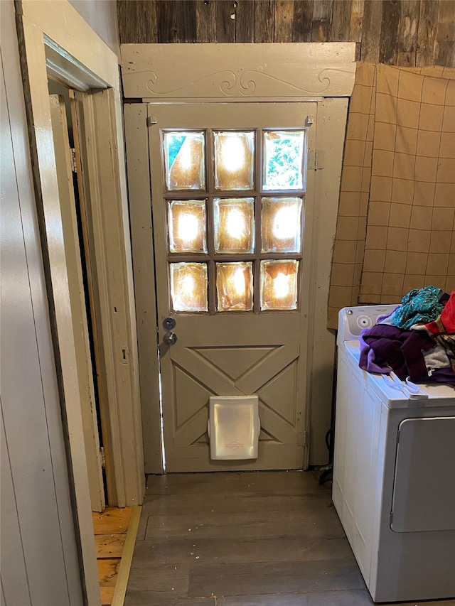 laundry room with washer / dryer and hardwood / wood-style flooring