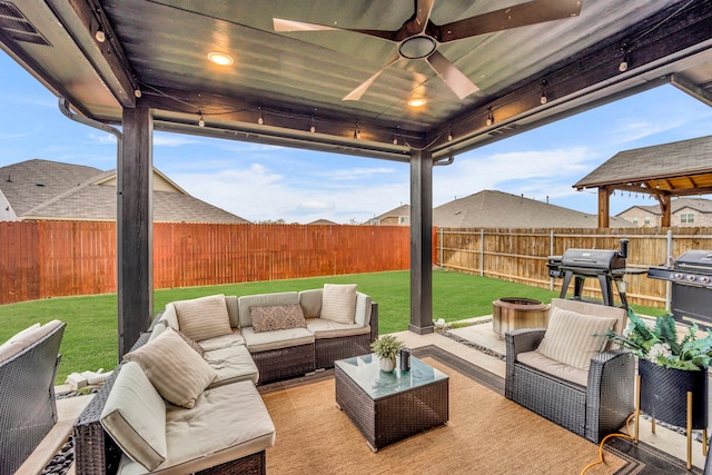 view of patio / terrace featuring outdoor lounge area, ceiling fan, a gazebo, and grilling area