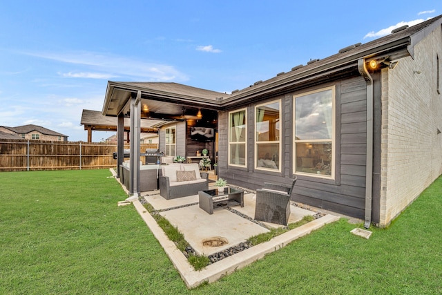 exterior space featuring a patio, a yard, and an outdoor hangout area