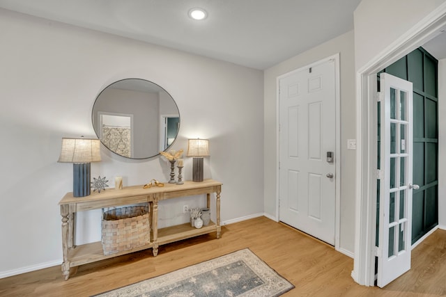 foyer entrance featuring hardwood / wood-style floors