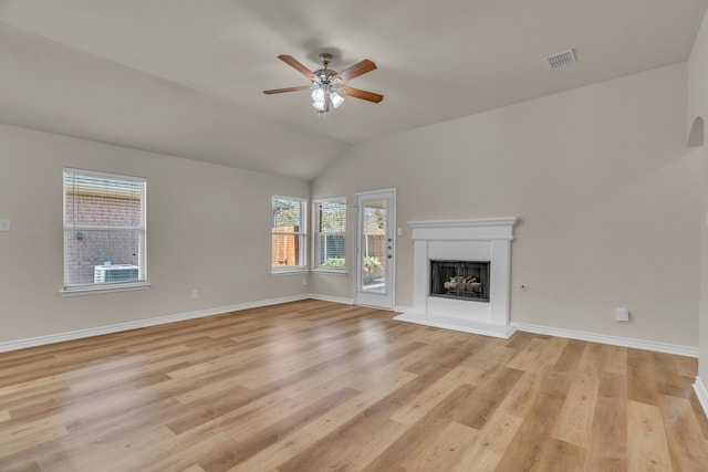 unfurnished living room featuring ceiling fan, light wood-type flooring, and lofted ceiling