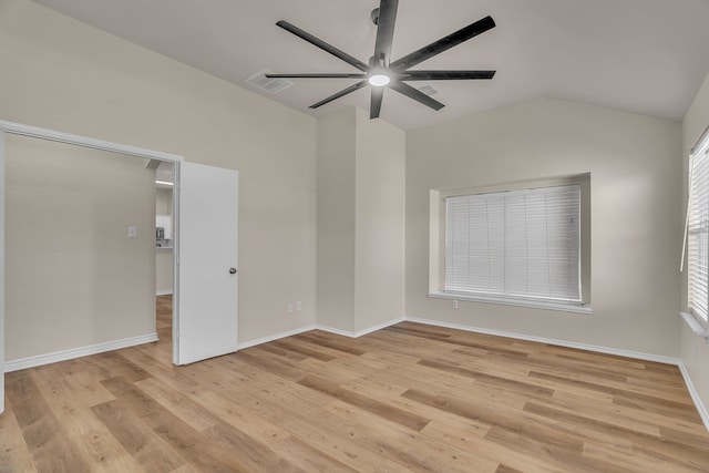 unfurnished room with light hardwood / wood-style floors, ceiling fan, and lofted ceiling