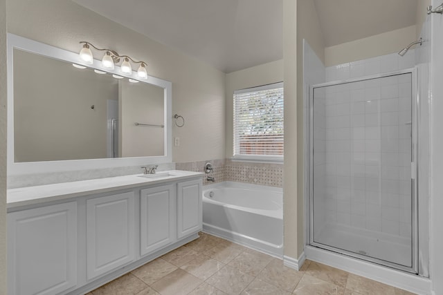 bathroom featuring vanity, tile patterned floors, and plus walk in shower