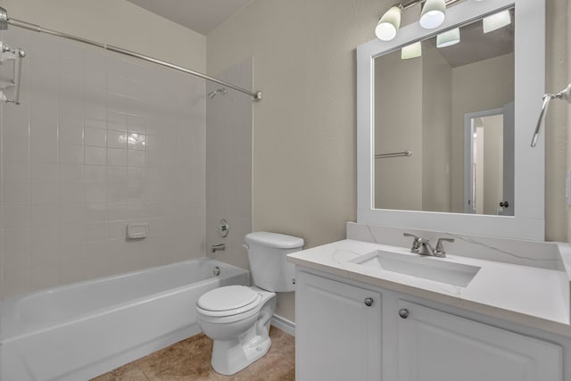 full bathroom with tile patterned flooring, vanity, tiled shower / bath combo, and toilet