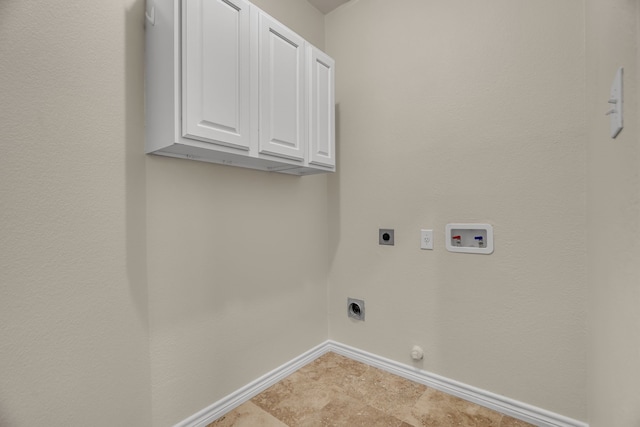 laundry area with cabinets, gas dryer hookup, electric dryer hookup, and hookup for a washing machine