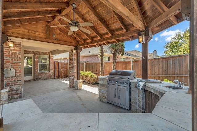 view of patio with sink, a gazebo, ceiling fan, exterior kitchen, and area for grilling