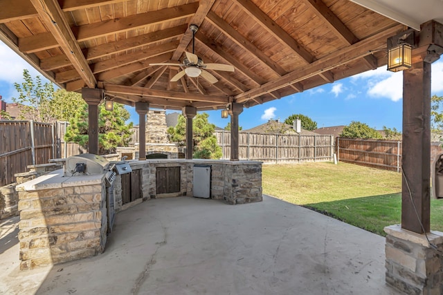 view of patio with an outdoor kitchen, ceiling fan, and a gazebo