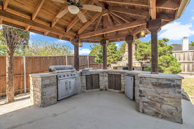 view of patio / terrace featuring ceiling fan, area for grilling, a grill, and a gazebo