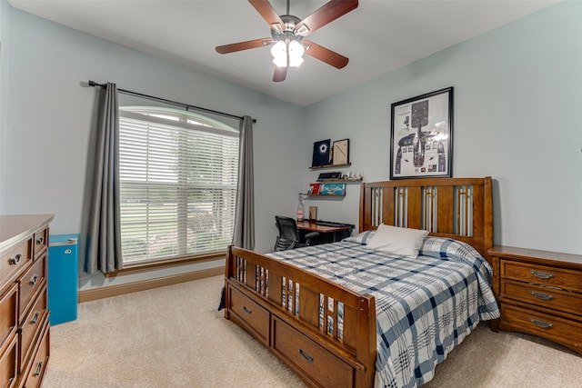 bedroom featuring light carpet and ceiling fan