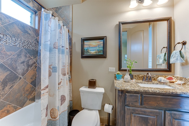 full bathroom with shower / bath combo, vanity, and toilet