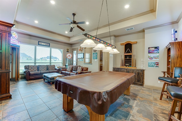 recreation room with ceiling fan, a tray ceiling, billiards, and ornamental molding