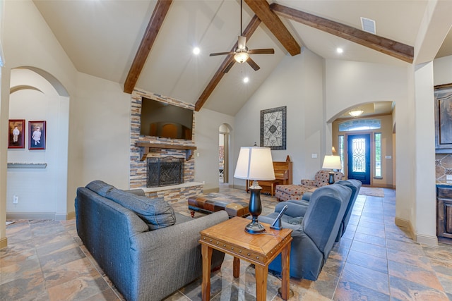 living room with high vaulted ceiling, a fireplace, beamed ceiling, and ceiling fan