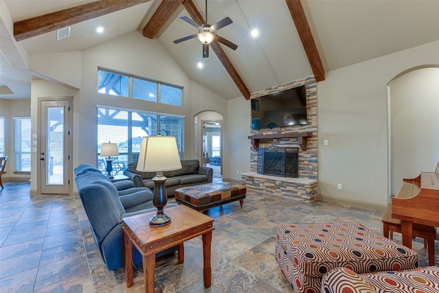 living room with a fireplace, beamed ceiling, ceiling fan, and high vaulted ceiling