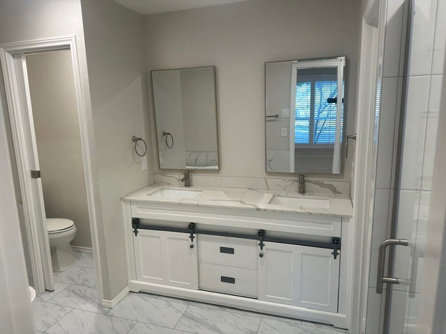 kitchen featuring gas stovetop, stainless steel microwave, decorative backsplash, ornamental molding, and white cabinetry