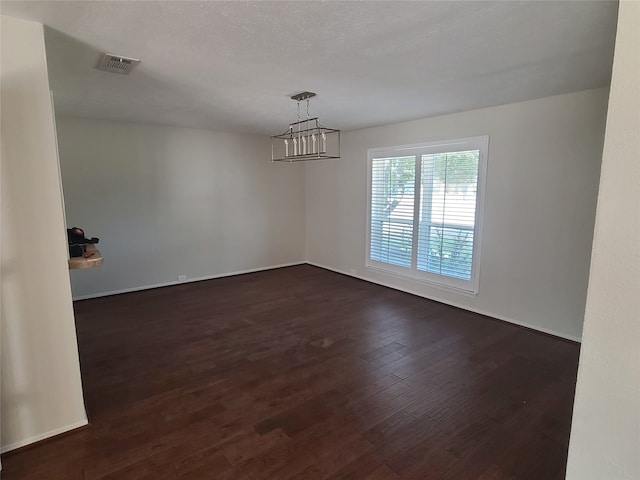 unfurnished room featuring dark hardwood / wood-style floors