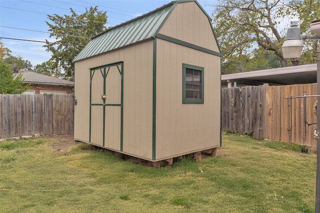 view of outbuilding with a lawn