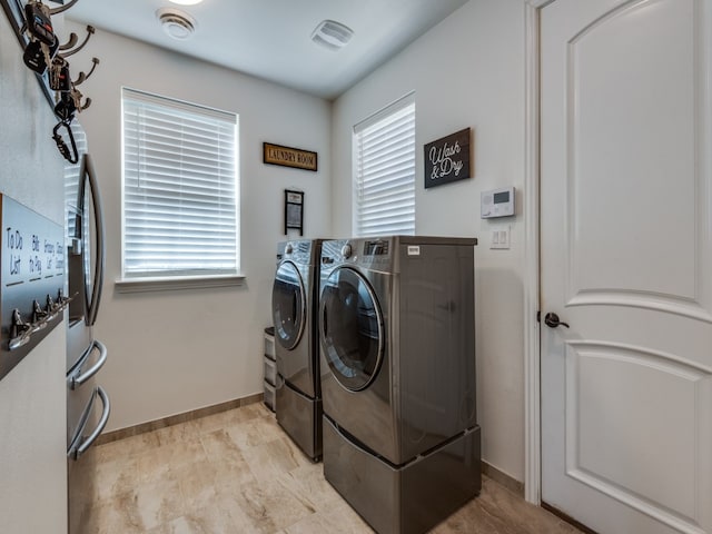 laundry room with washer and clothes dryer